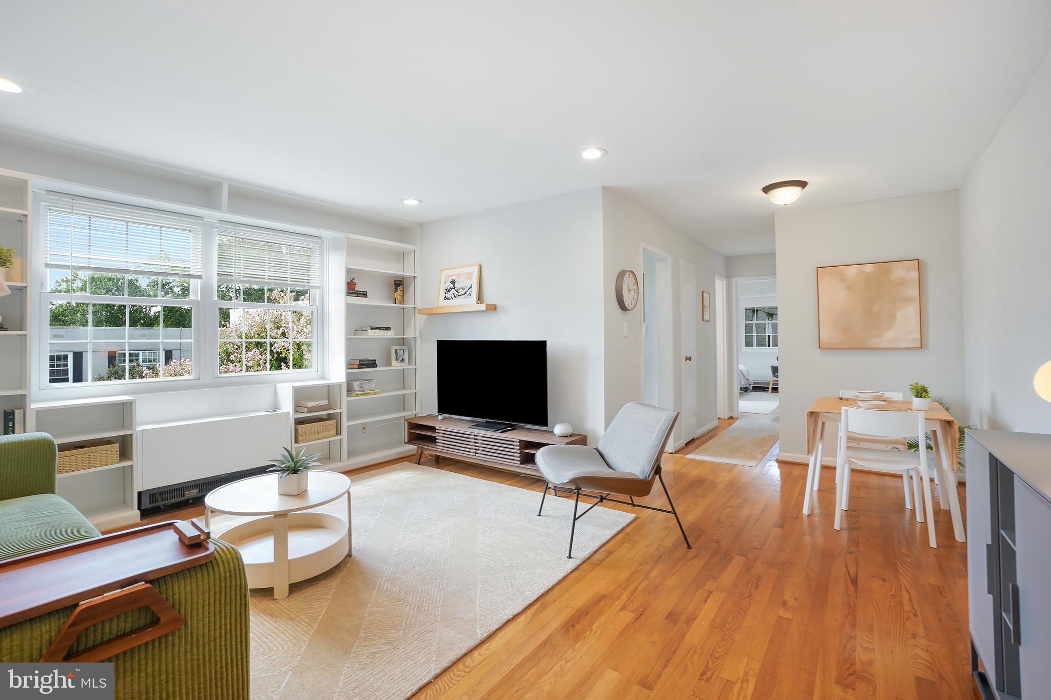 2030 North Vermont Street, Unit 301 Arlington, VA 22207 - Photo 2 of 32 a living room with furniture and a flat screen tv