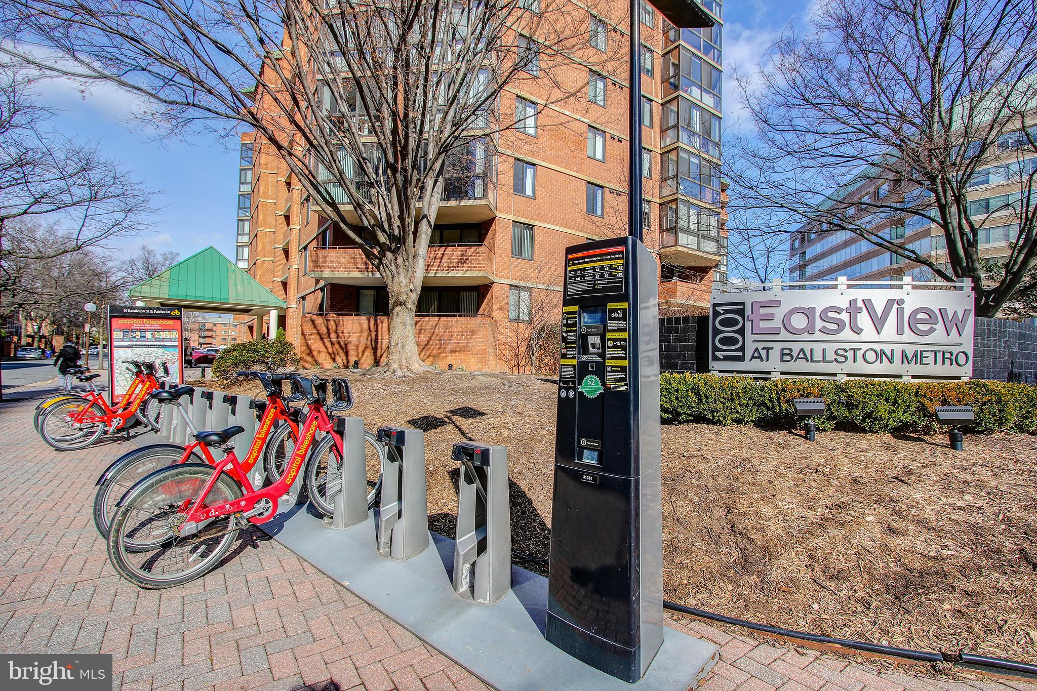 2030 North Vermont Street, Unit 301 Arlington, VA 22207 - Photo 30 of 32 a view of a brick building with many windows and a table