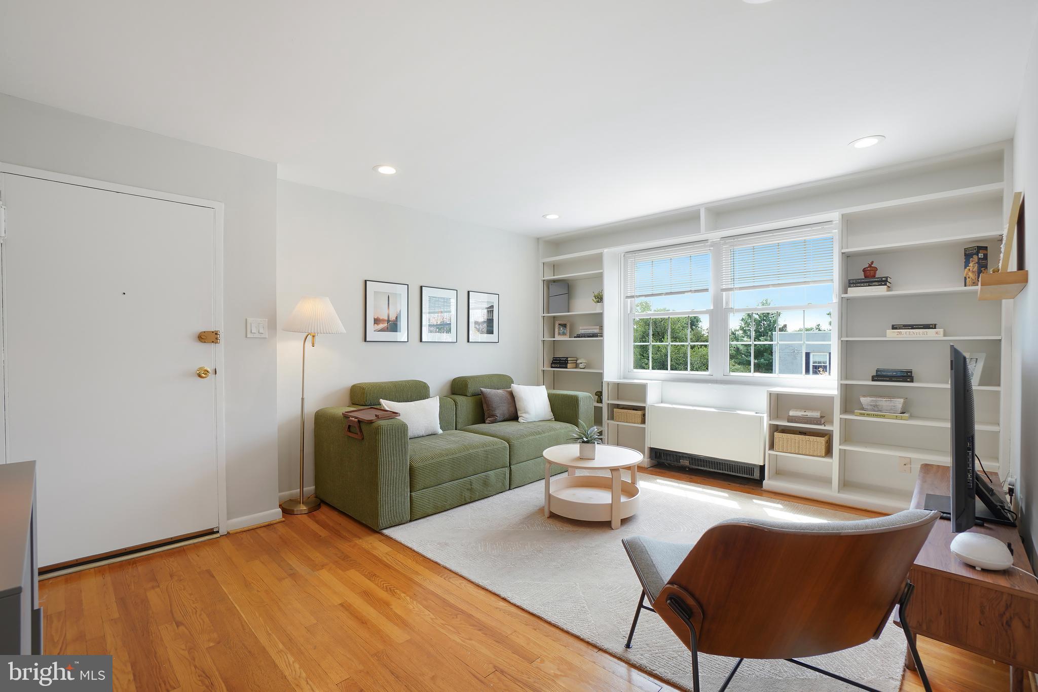 2030 North Vermont Street, Unit 301 Arlington, VA 22207 - Photo 3 of 32 a living room with furniture and a window