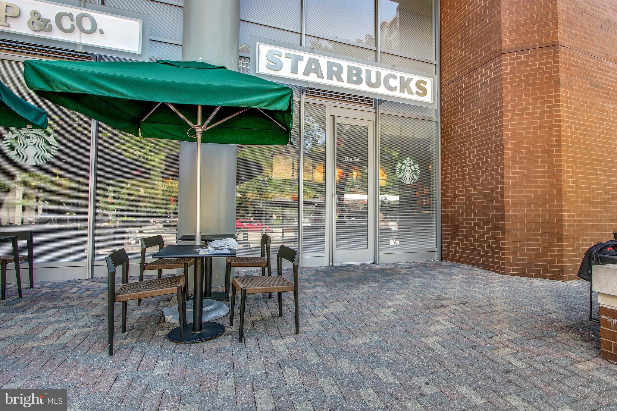 2030 North Vermont Street, Unit 301 Arlington, VA 22207 - Photo 31 of 32 a view of a dining room with furniture and chandelier