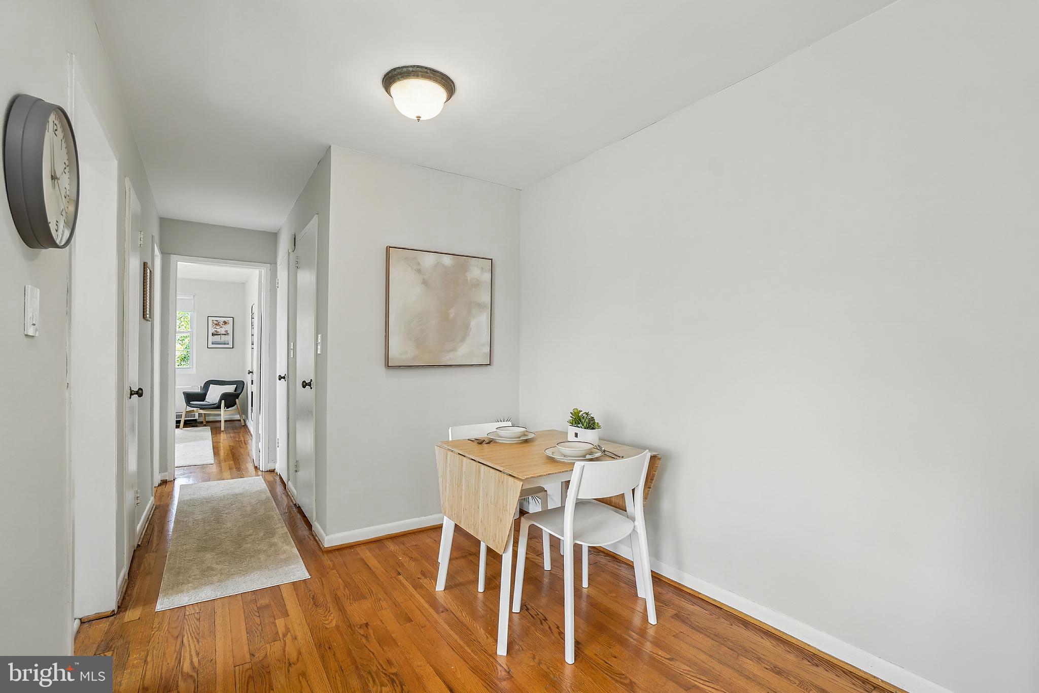 2030 North Vermont Street, Unit 301 Arlington, VA 22207 - Photo 5 of 32 a view of a room that has a table and chair in it