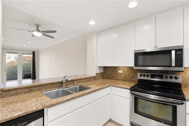 a kitchen with a stove and a microwave