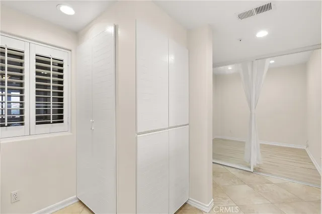 a view of a hallway with windows