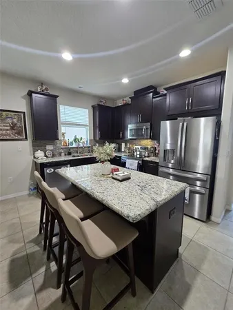 a bedroom with a bed next to a window