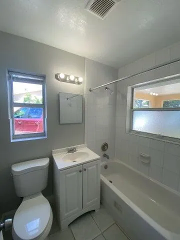 a bathroom with a toilet sink and bathtub