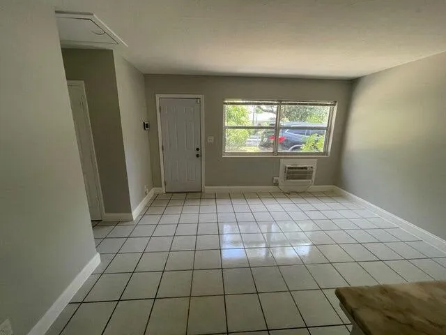 a view of an empty room and window