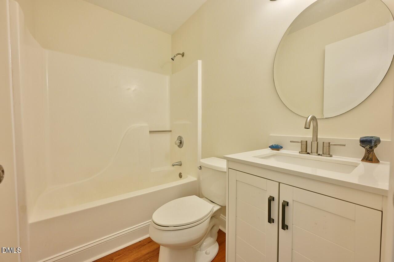 621 Martin Street Durham, NC 27704 - Photo 26 of 39 a bathroom with a sink toilet and shower