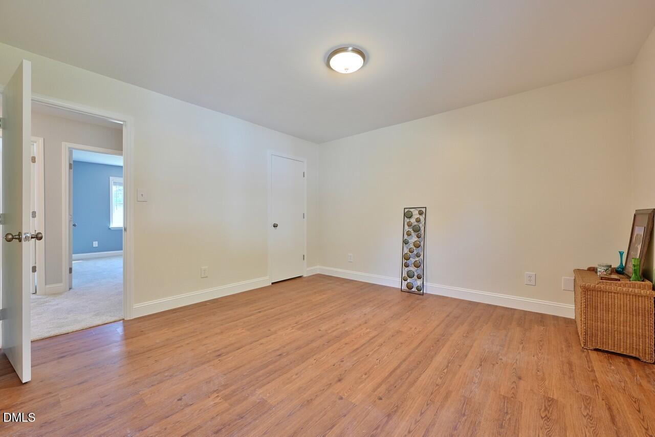 621 Martin Street Durham, NC 27704 - Photo 29 of 39 a view of an empty room with wooden floor