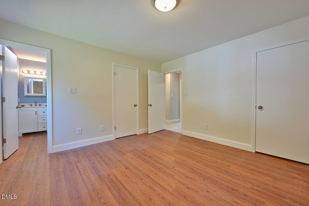 621 Martin Street Durham, NC 27704 - Photo 30 of 39 a view of empty room with wooden floor
