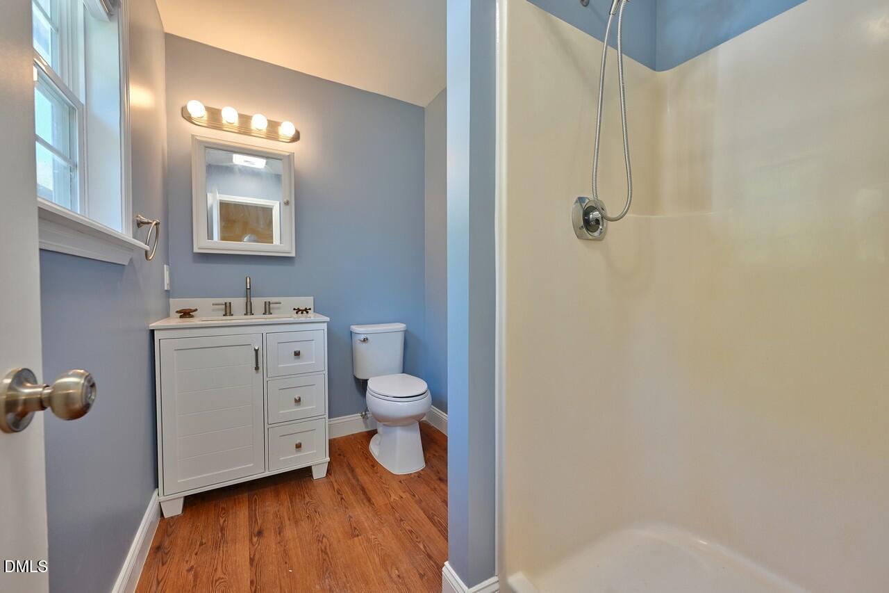 621 Martin Street Durham, NC 27704 - Photo 31 of 39 a bathroom with a sink toilet and shower