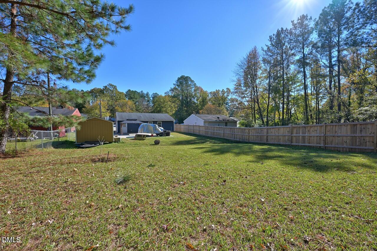 621 Martin Street Durham, NC 27704 - Photo 4 of 39 a backyard of a house with lots of green space