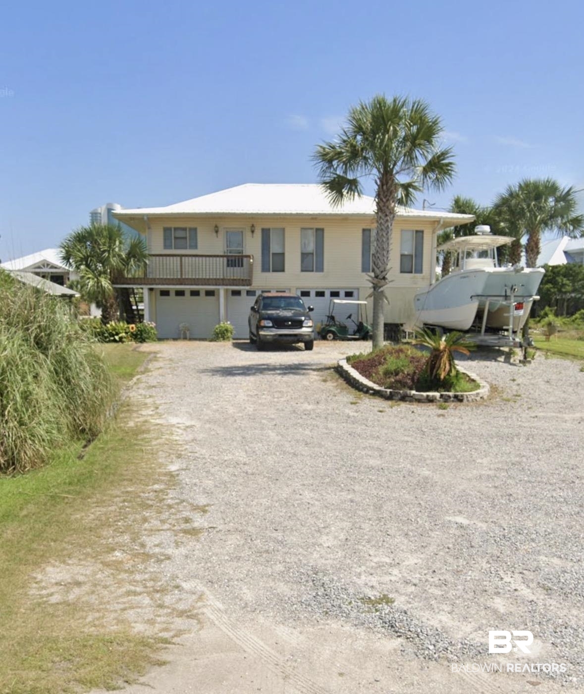 26222 Marina Road Orange Beach, AL 36561 - Photo 2 of 38 View of front facade featuring driveway and an attached garage