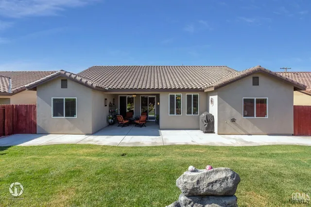 a front view of a house with a yard and porch