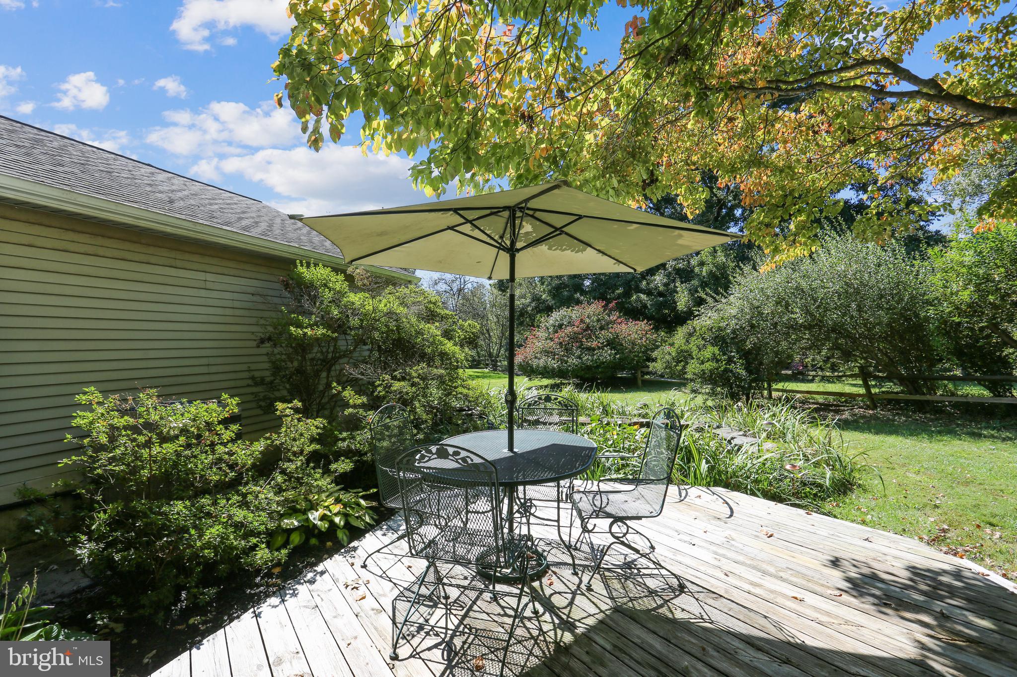 9301 Huntmaster Road Laytonsville, MD 20882 - Photo 75 of 99 Deck is adjacent to the Koi pond