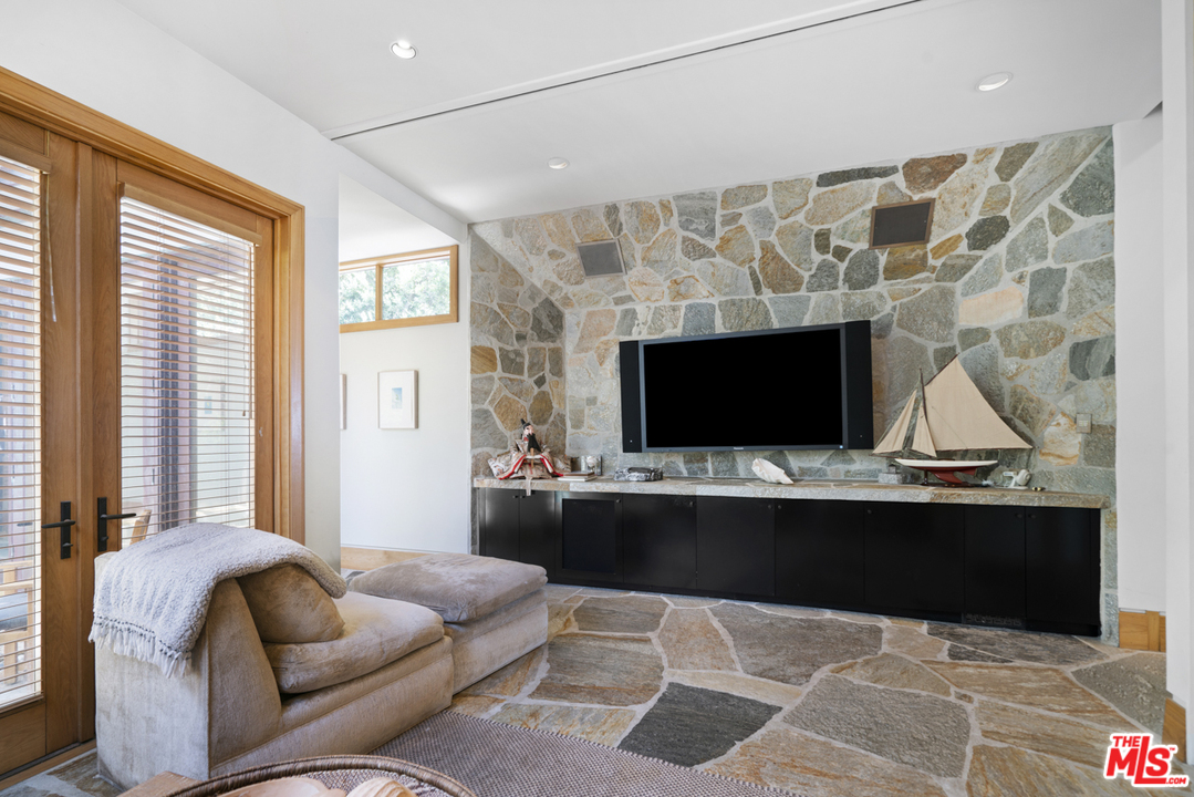 31030 Broad Beach Road Malibu, CA 90265 - Photo 12 of 45 a living room with furniture and a flat screen tv