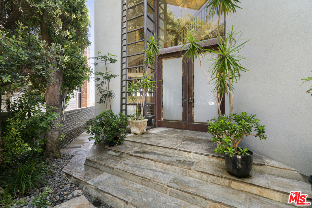 31030 Broad Beach Road Malibu, CA 90265 - Photo 3 of 45 a view of a house with a flower garden
