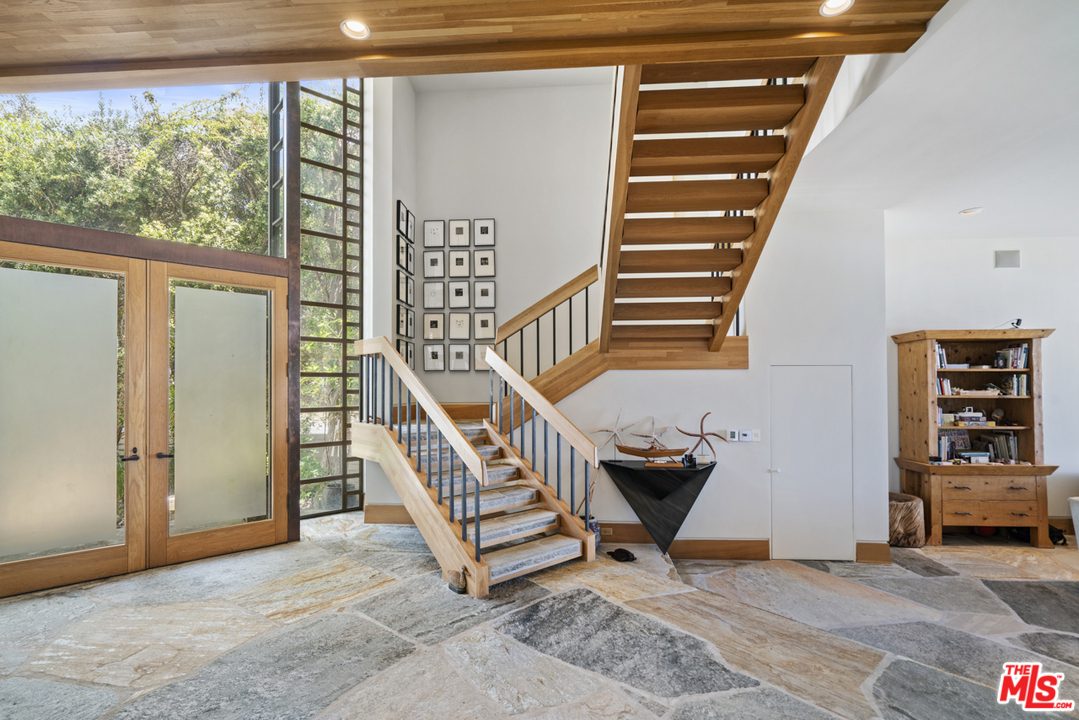 31030 Broad Beach Road Malibu, CA 90265 - Photo 5 of 45 a view of entryway with a window and stairs