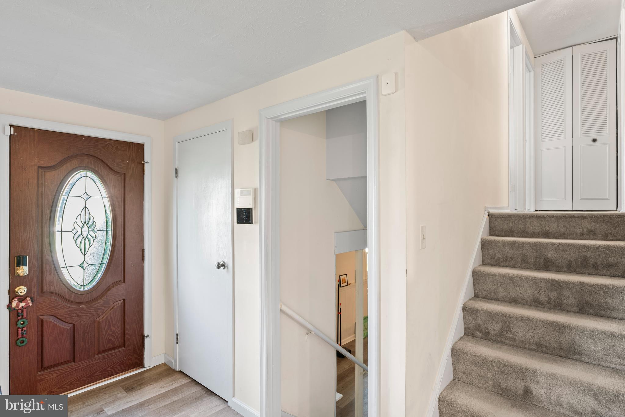 7627 Fallswood Way Lorton, VA 22079 - Photo 13 of 38 a view of entryway with wooden floor