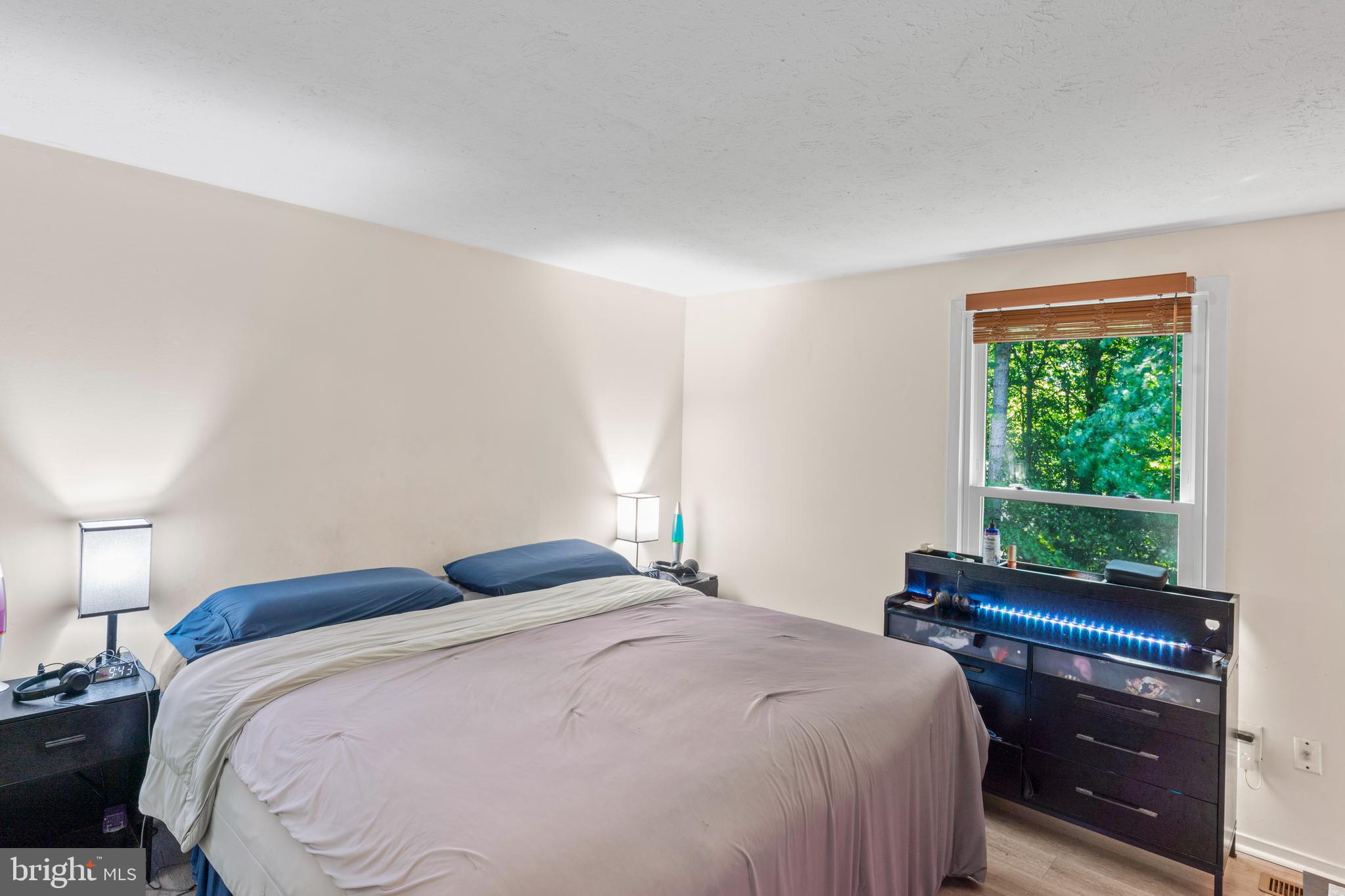 7627 Fallswood Way Lorton, VA 22079 - Photo 14 of 38 a bedroom with a bed and a window