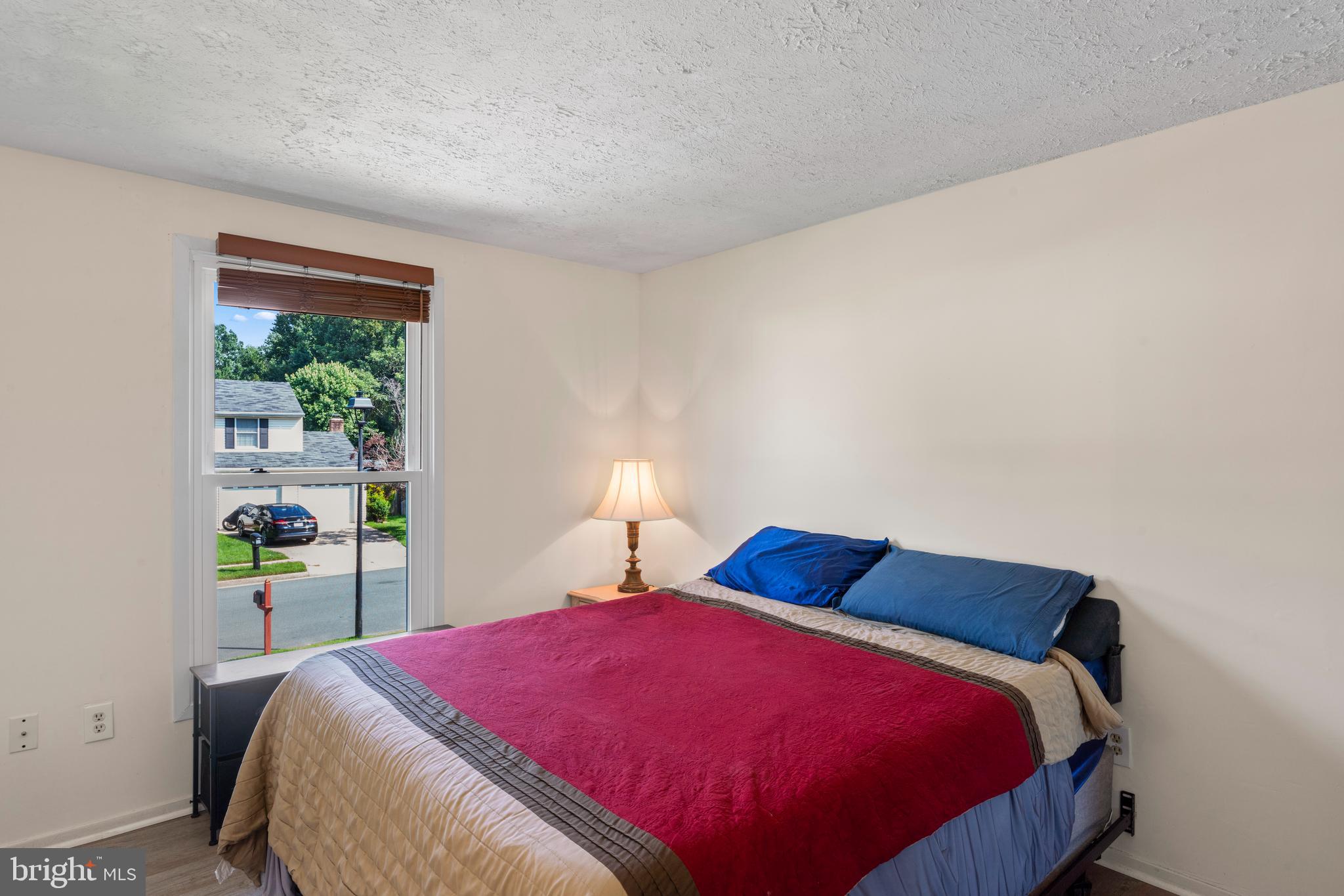 7627 Fallswood Way Lorton, VA 22079 - Photo 19 of 38 a bedroom with a bed and a window