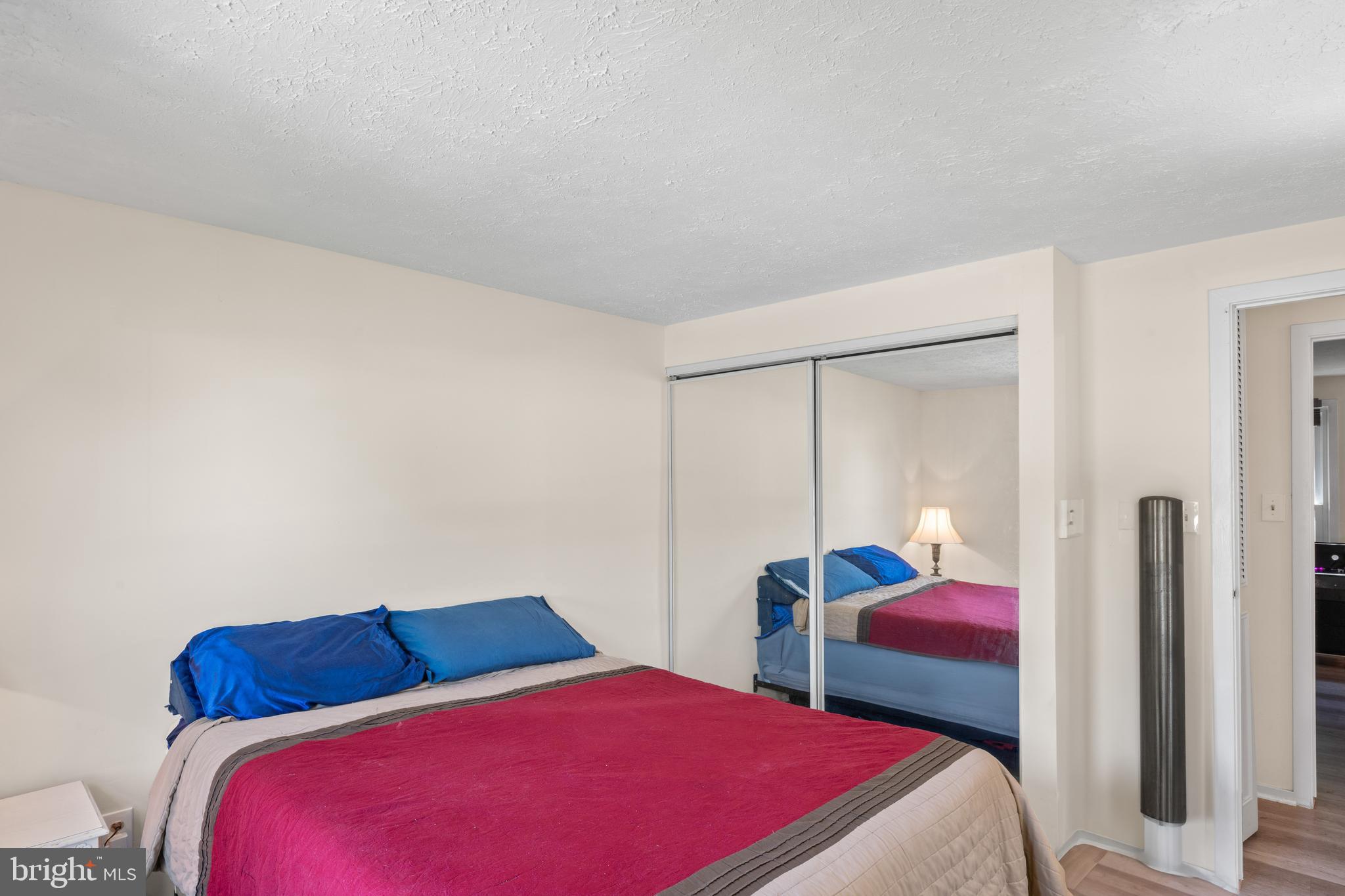 7627 Fallswood Way Lorton, VA 22079 - Photo 20 of 38 a bedroom with two bed and a closet