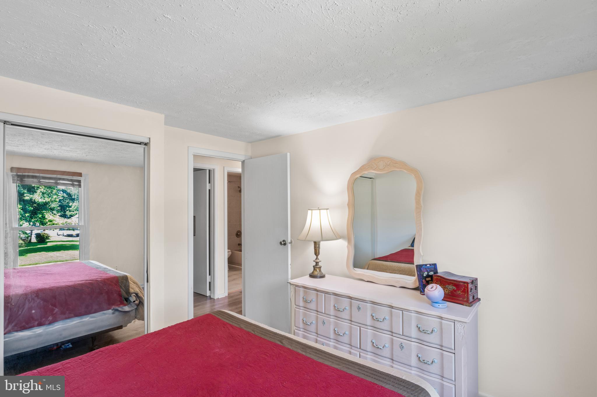 7627 Fallswood Way Lorton, VA 22079 - Photo 21 of 38 a bedroom with furniture and a window