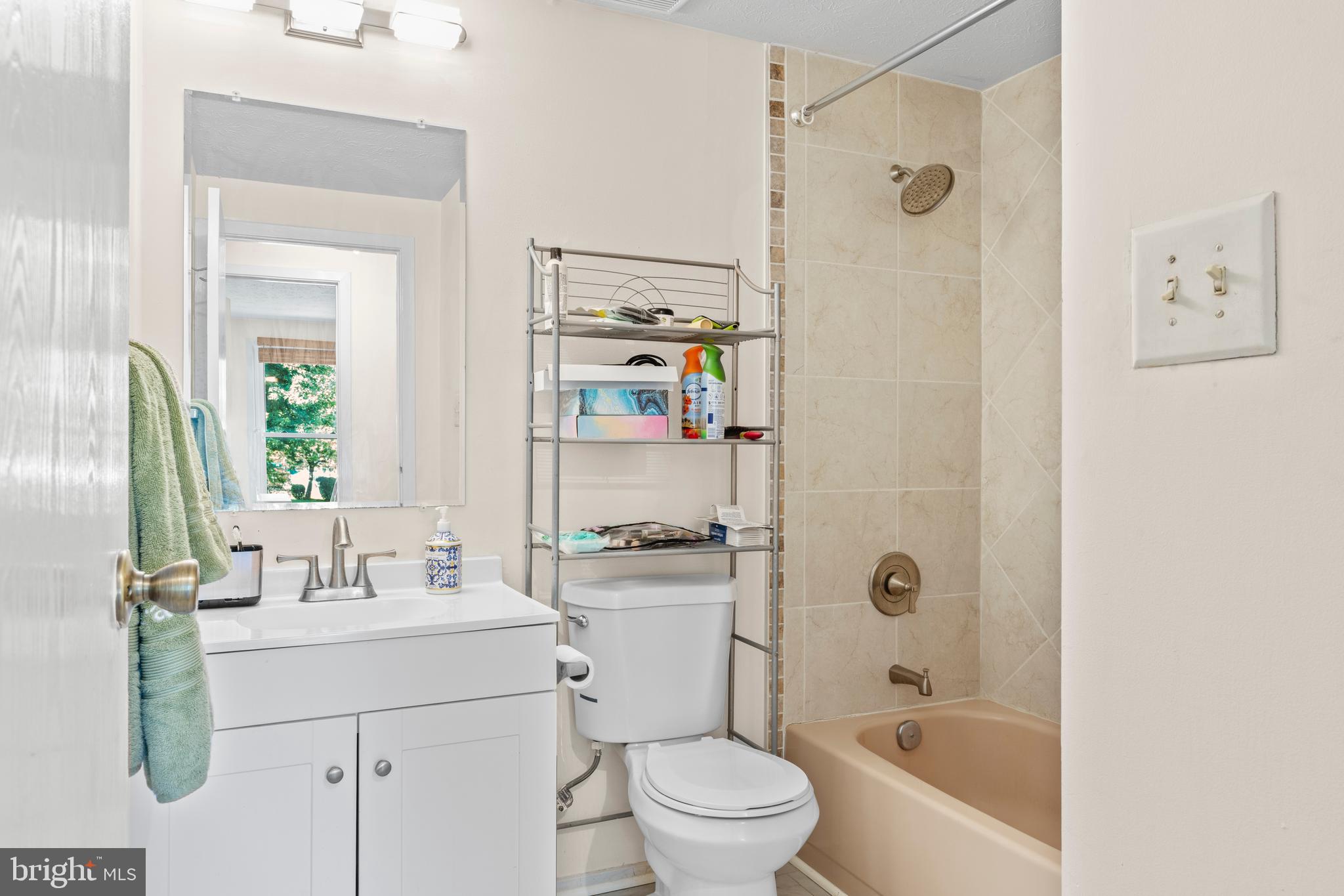 7627 Fallswood Way Lorton, VA 22079 - Photo 24 of 38 a bathroom with a sink a toilet and shower