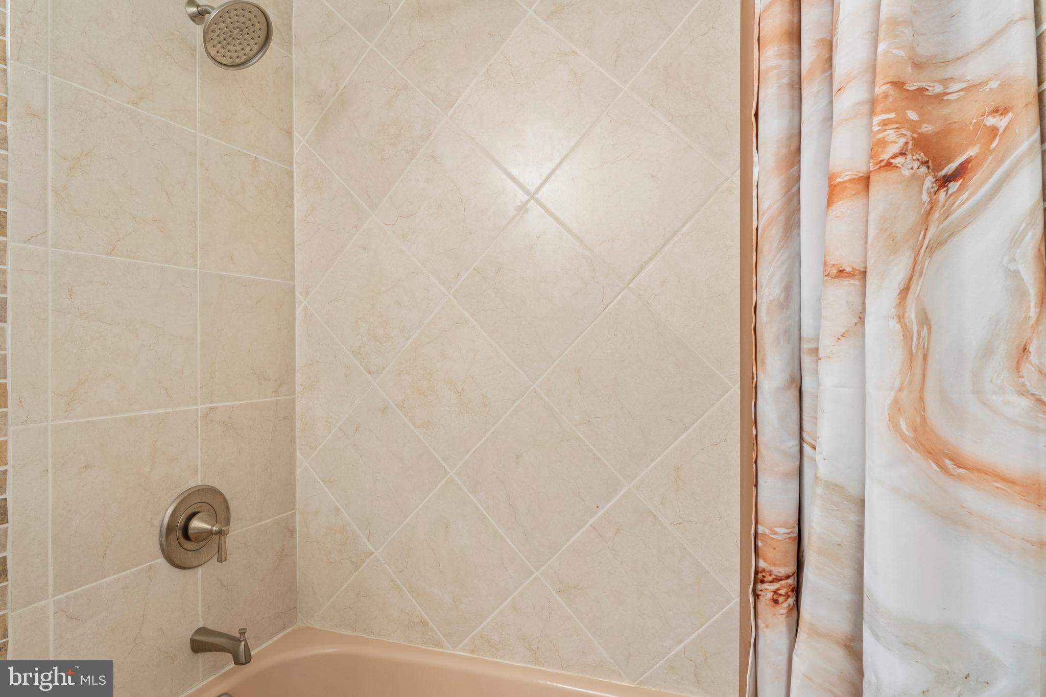 7627 Fallswood Way Lorton, VA 22079 - Photo 25 of 38 a bathroom with a shower