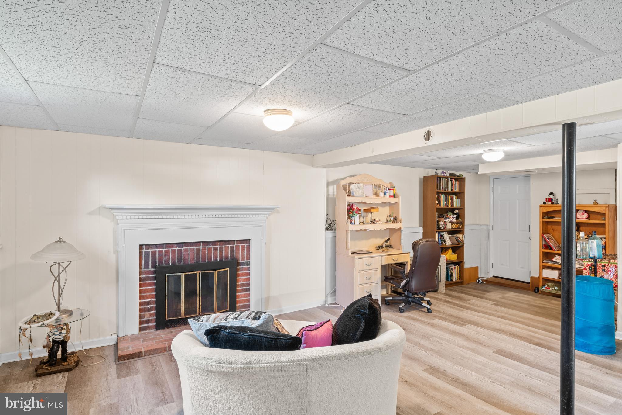 7627 Fallswood Way Lorton, VA 22079 - Photo 26 of 38 a living room with furniture and a fireplace