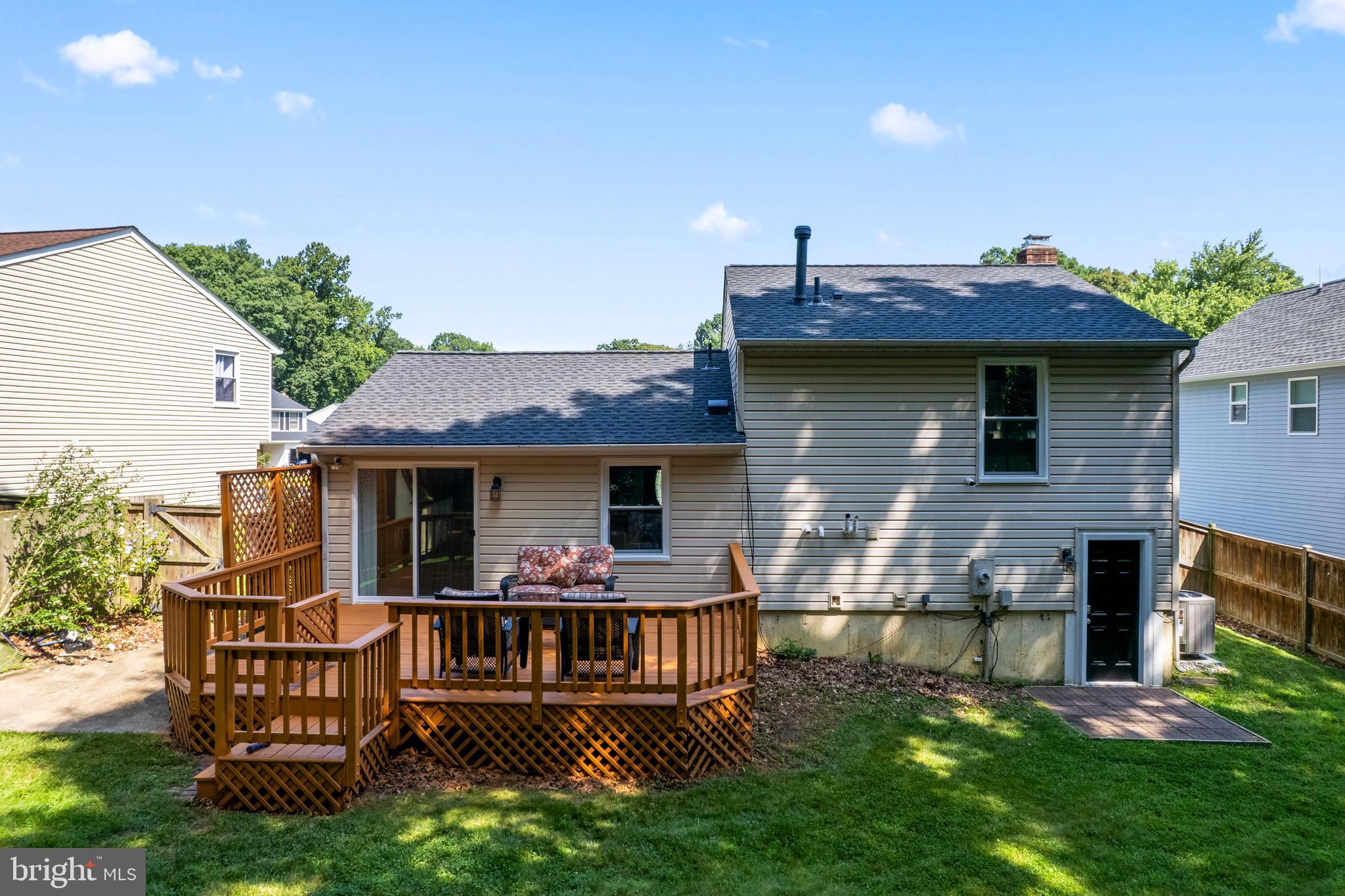 7627 Fallswood Way Lorton, VA 22079 - Photo 32 of 38 a view of a house with a yard porch and furniture