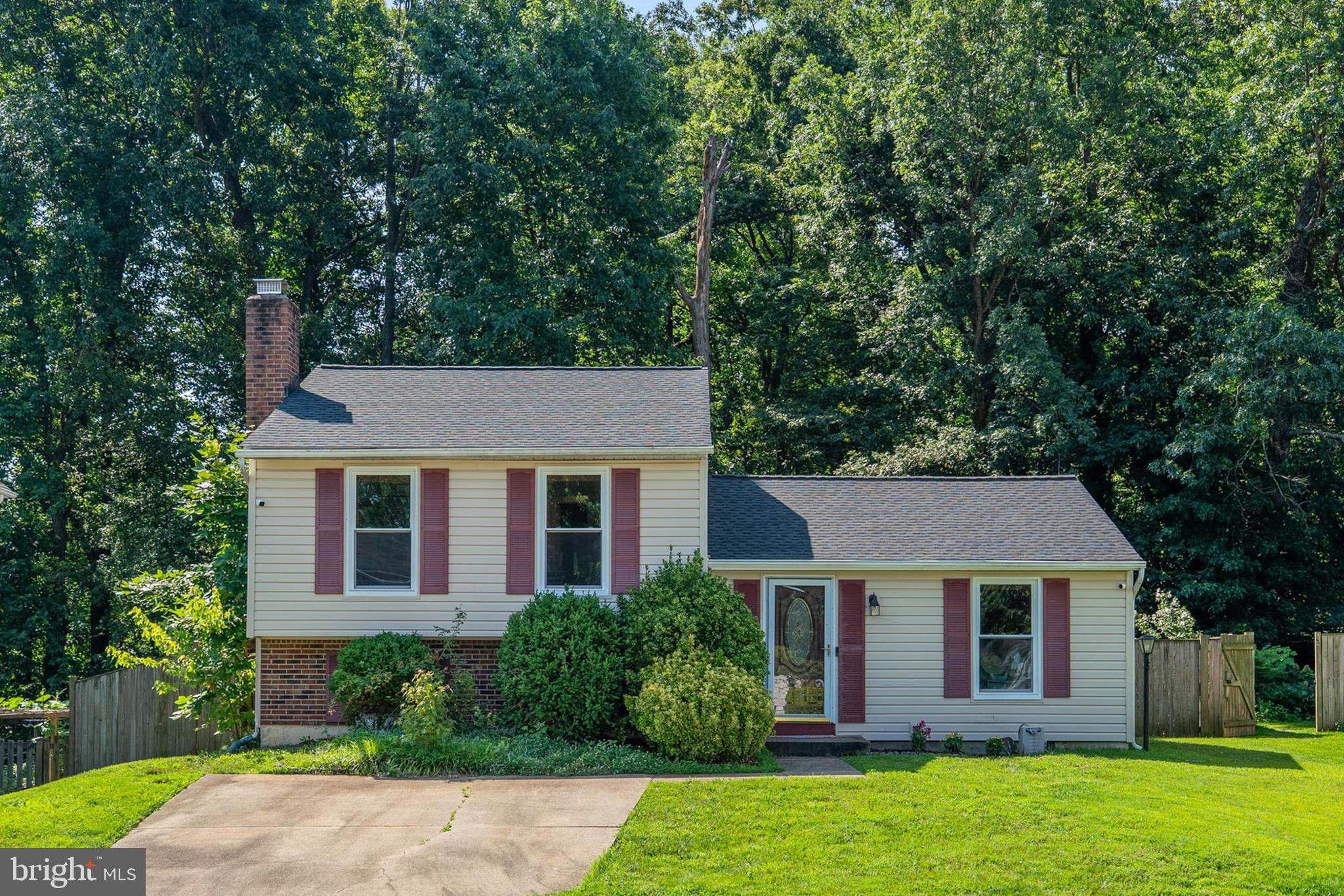 7627 Fallswood Way Lorton, VA 22079 - Photo 6 of 38 a front view of house with yard and green space