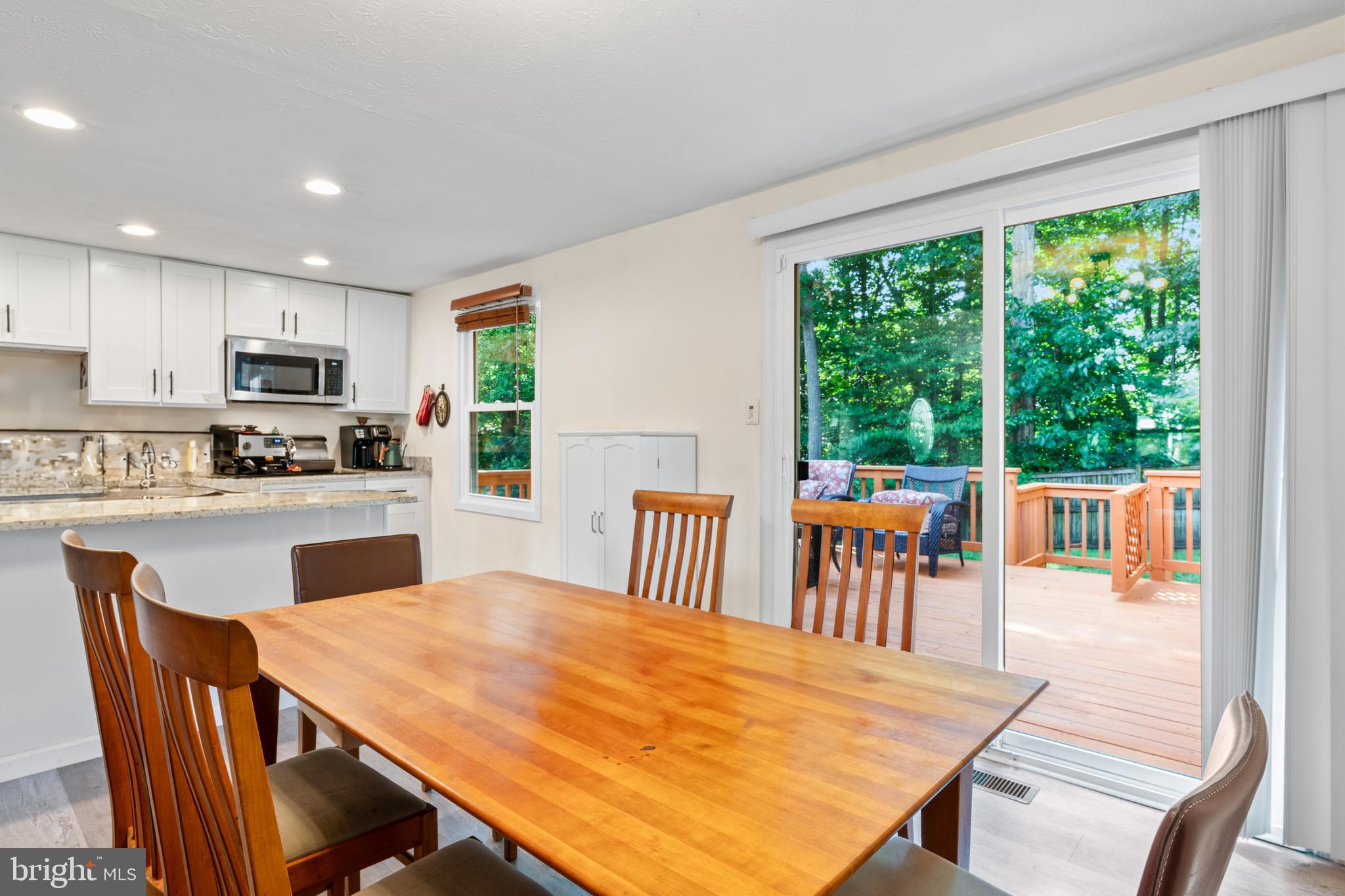 7627 Fallswood Way Lorton, VA 22079 - Photo 9 of 38 a view of a dining room with furniture window and outside view