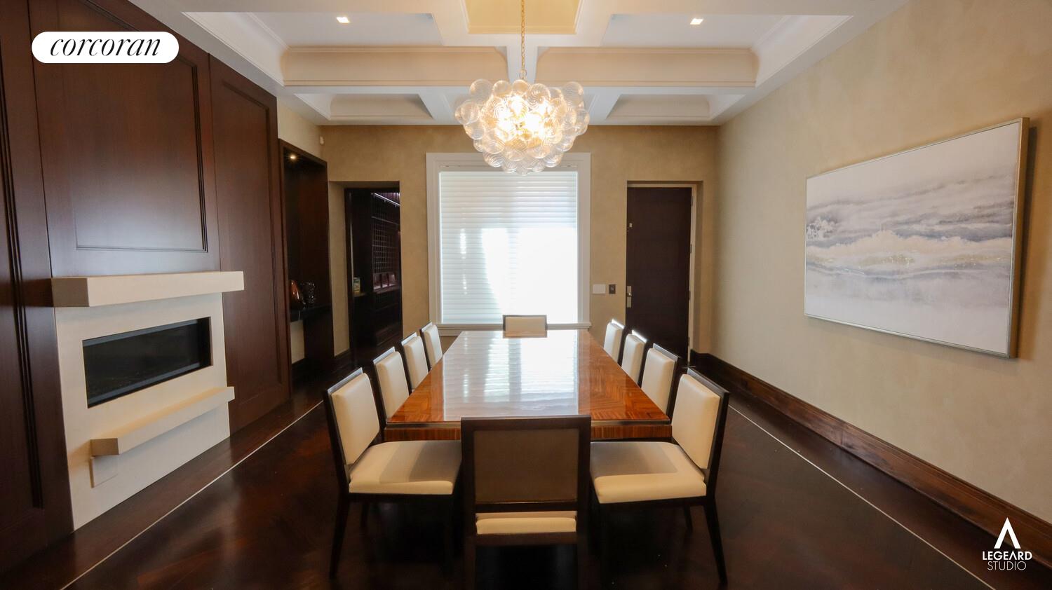46 East 66th Street Manhattan, NY 10065 - Photo 15 of 64 a view of a dining room with furniture a chandelier and wooden floor
