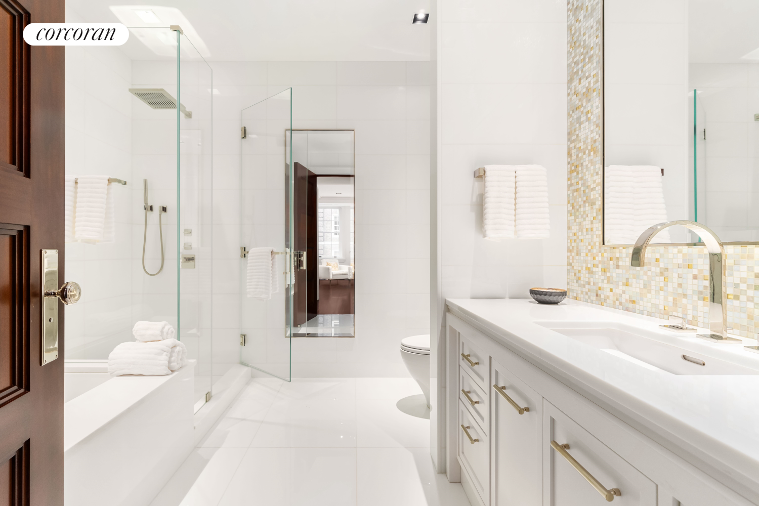 46 East 66th Street Manhattan, NY 10065 - Photo 24 of 64 a spacious bathroom with a shower sink and a mirror