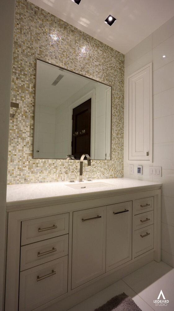 46 East 66th Street Manhattan, NY 10065 - Photo 54 of 64 a bathroom with a double vanity sink and mirror