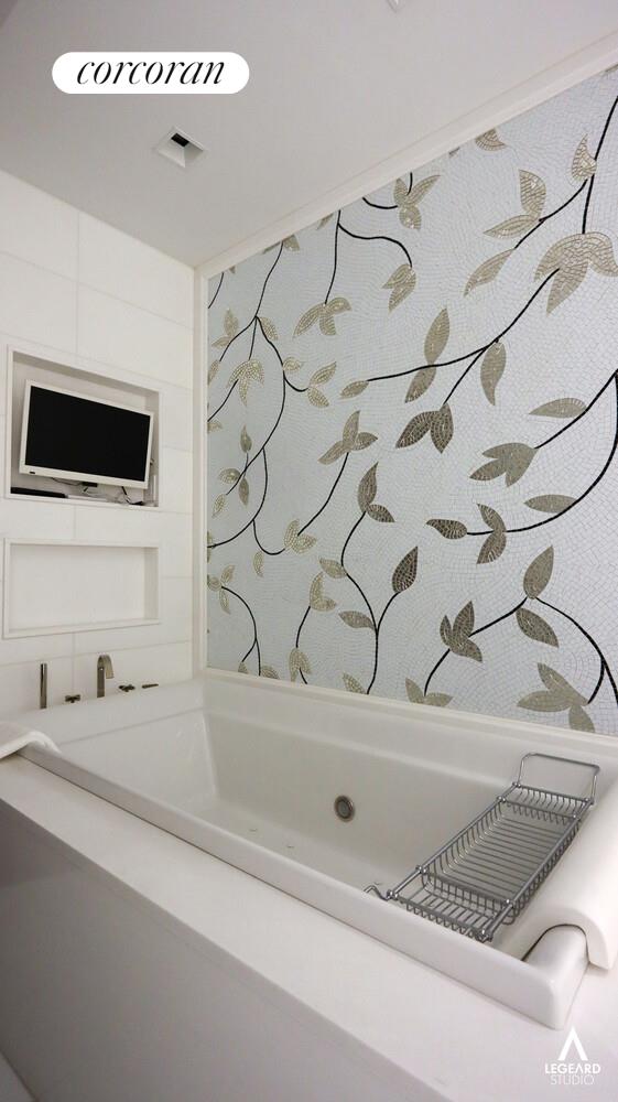 46 East 66th Street Manhattan, NY 10065 - Photo 58 of 64 a bathroom with a bathtub and a sink