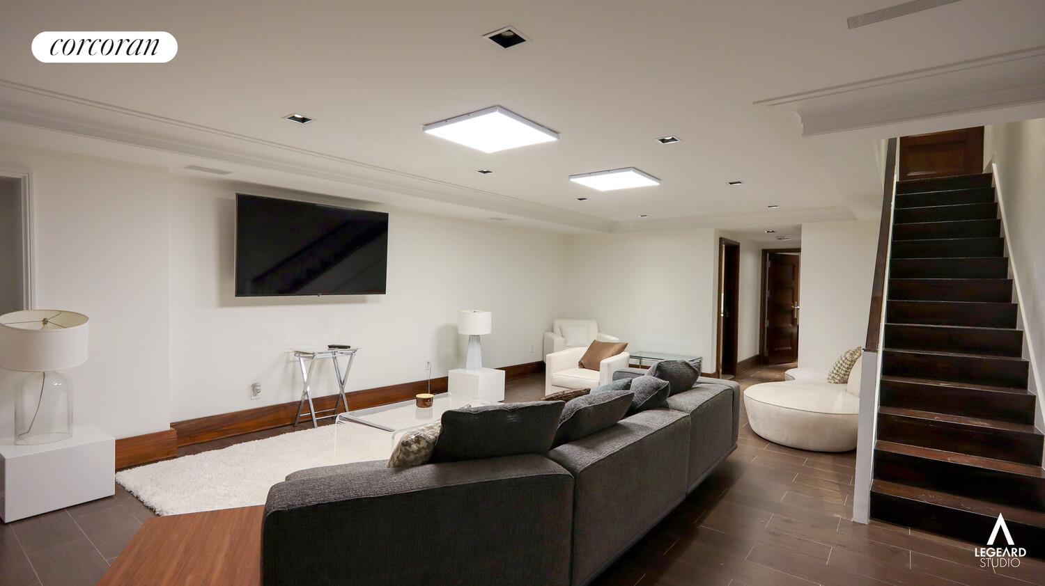 46 East 66th Street Manhattan, NY 10065 - Photo 62 of 64 a living room with furniture and a flat screen tv