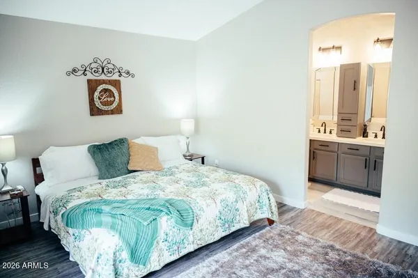 a bedroom with a bed and a table