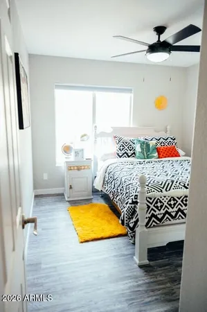 a bedroom with a bed and a window