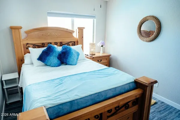 a bedroom with a bed and a window