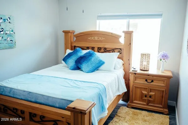 a bedroom with a bed and window