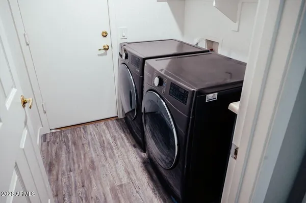 a utility room with dryer and washer