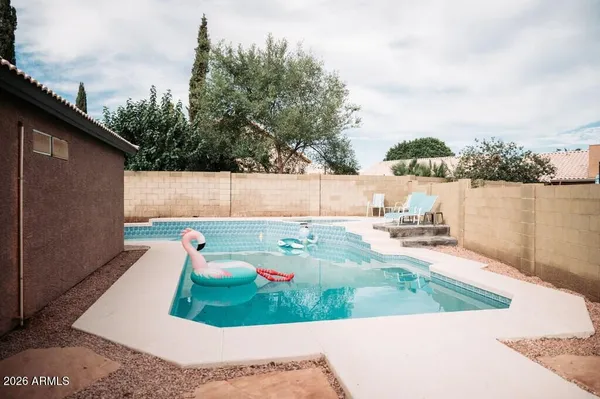 a view of a backyard with sitting area