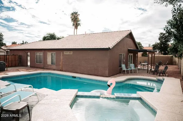a view of a house with swimming pool