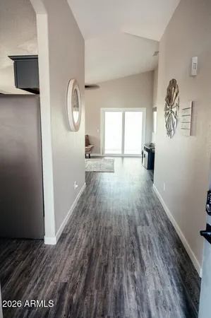 wooden floor in an empty room and a window