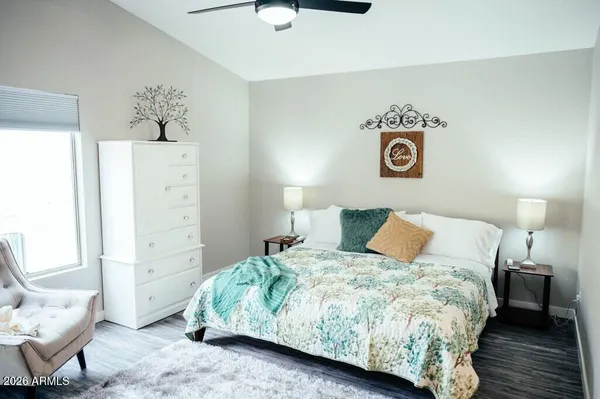 a bedroom with a bed and a couch