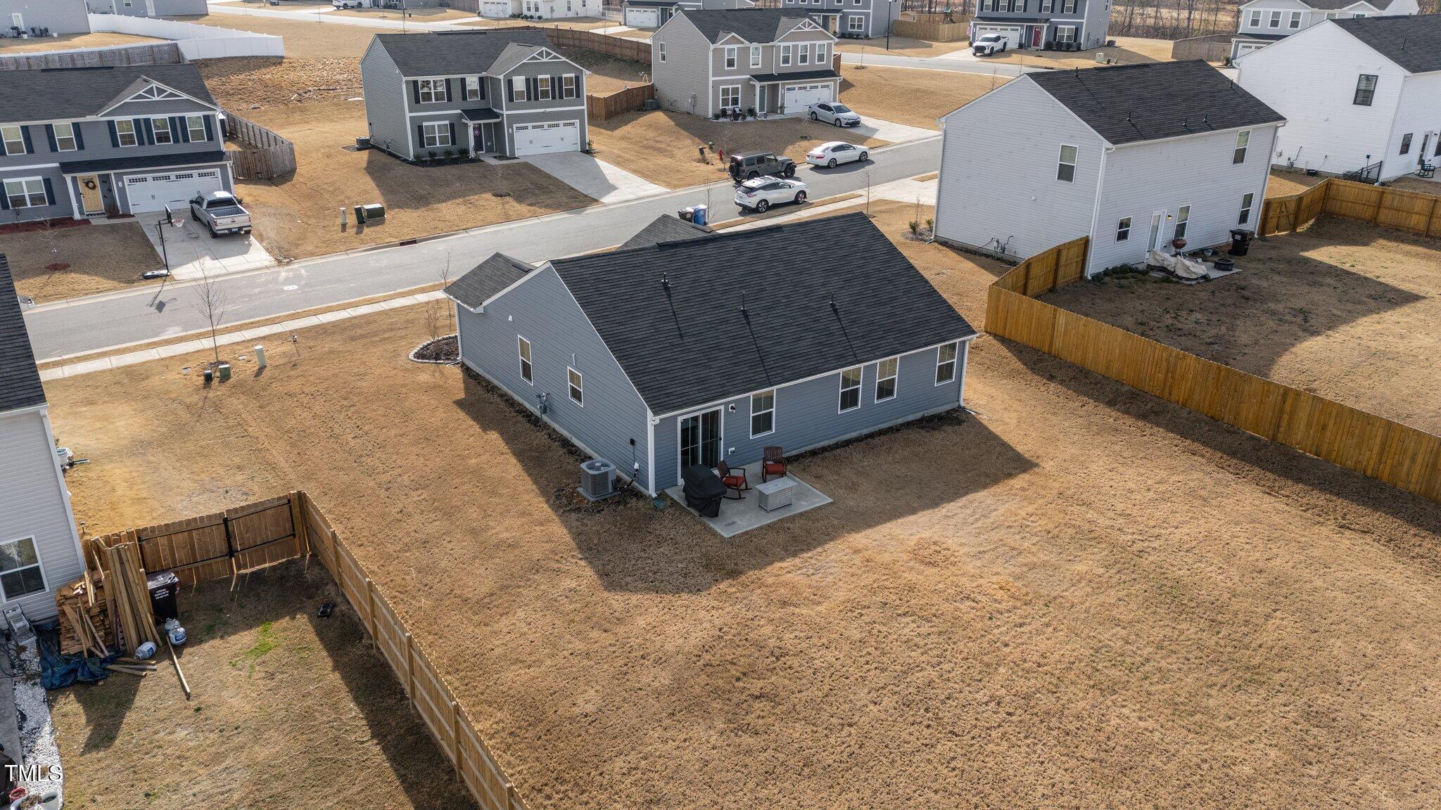 45 Florentine Court Angier, NC 27501 - Photo 13 of 27 a view of a house with backyard