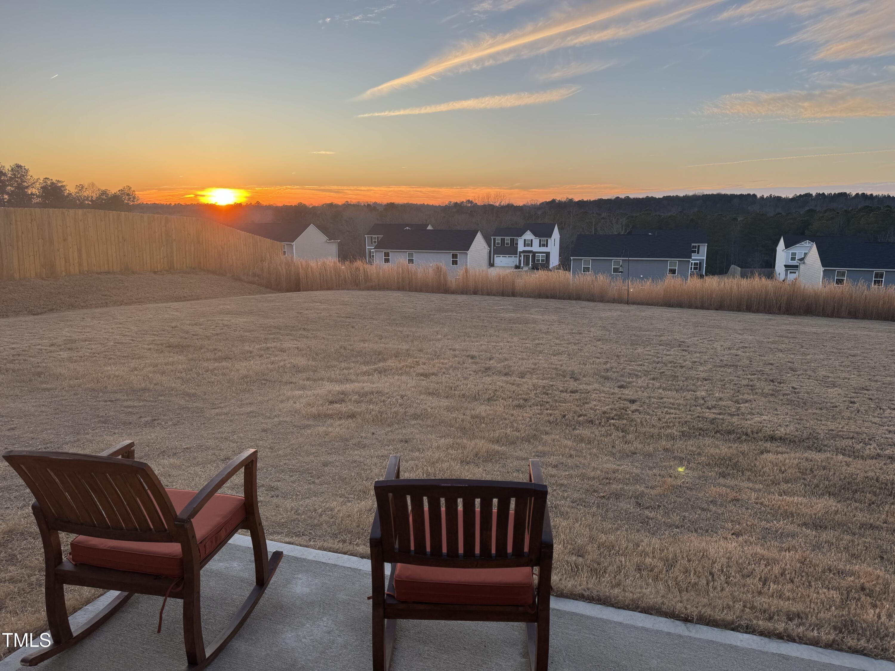 45 Florentine Court Angier, NC 27501 - Photo 2 of 27 a view of terrace with seating area and lake view