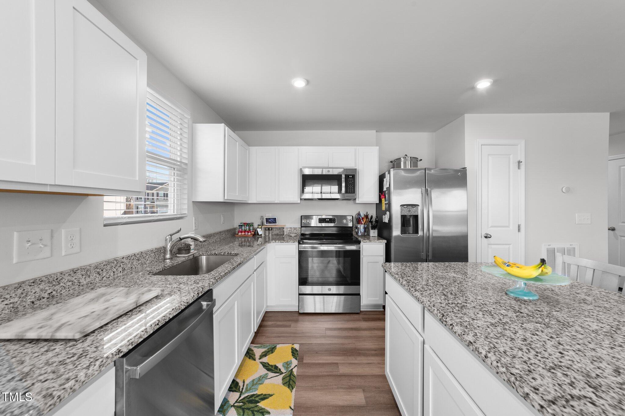 45 Florentine Court Angier, NC 27501 - Photo 21 of 27 a kitchen with a stove sink and refrigerator