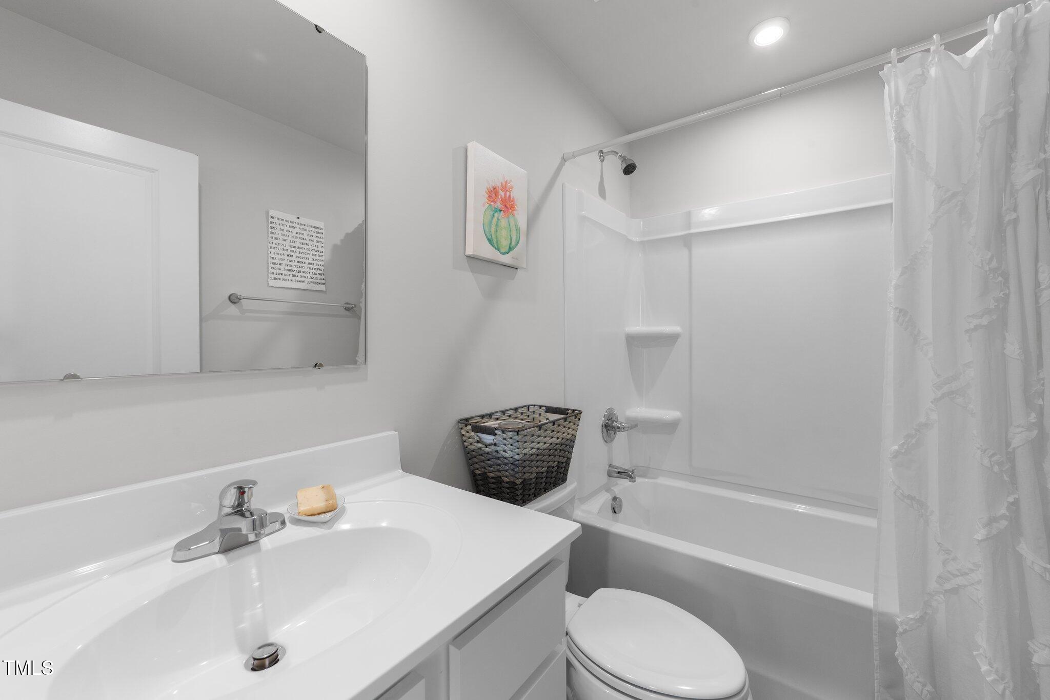 45 Florentine Court Angier, NC 27501 - Photo 24 of 27 a bathroom with a sink toilet and shower